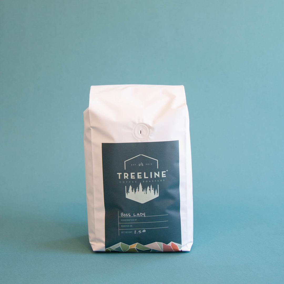 A white bag of coffee beans from Rosso Coffee Roasters